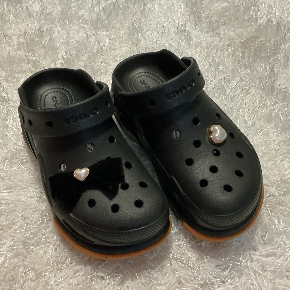 CROCS Black Slip-On Clogs with Orange Soles and Pearl Charms